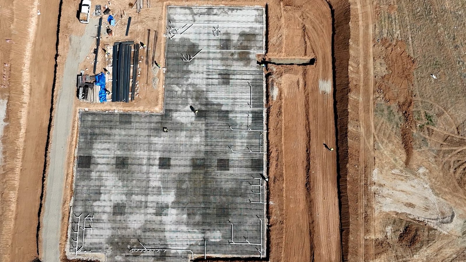 Overhead view of a foundation slab prepared for concrete works